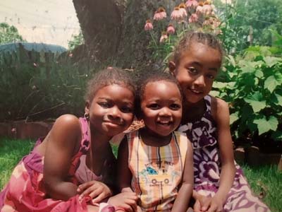 Three children enjoying the outdoors