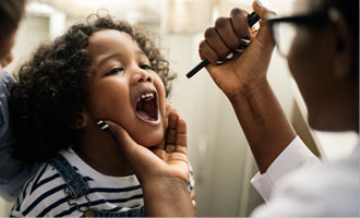Physician examining a child